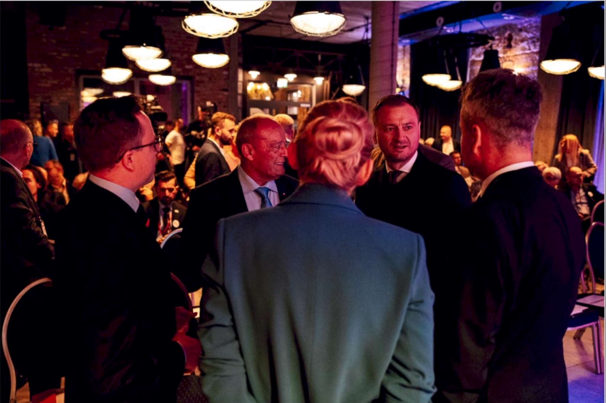 Conference networking moment in low light